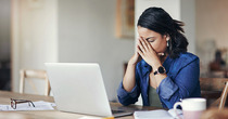 stressed female worker on computer