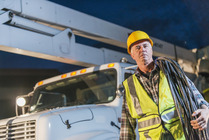 male worker on site near workplace vehicle