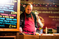 Male worker serving at Christmas Marker stall