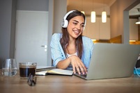 young female worker on a work call from home