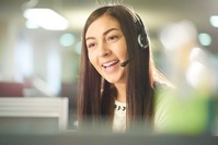 female worker on microphone speaking to customer