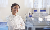 female scientist wearing goggles in lab