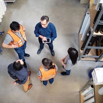 team meeting in warehouse