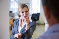 worker behaving aggressively towards co-worker