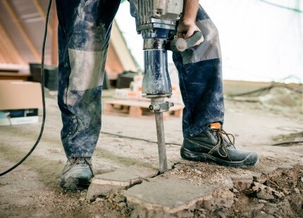 Worker using power tool