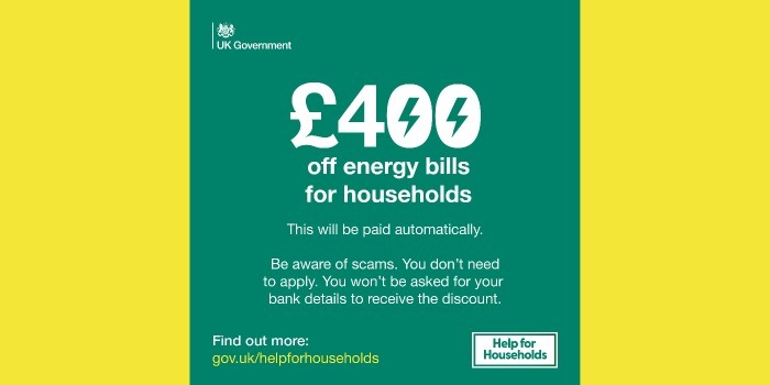 Help for households green and white graphic text reads £400 off for households