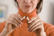 [Stock image] woman breaking cigarette