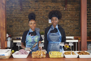 Elyse Duncan-Brown and Santina Robinson at the outdoor food kitchen