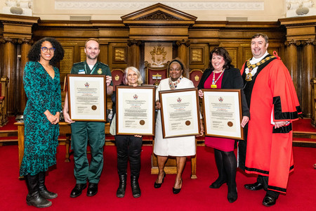Cllr Kaya Comer-Schwartz, the Mayor of Islington and the winners of the Freedom of the Borough award