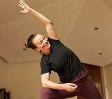 Trainer yoga expert Jessica facilitating a staff yoga session