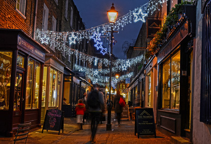 Camden Passage Islington with Christmas lights along the street
