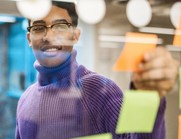 Image of a person looking at ideas on a board