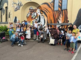 A large group of parents and children at London Zoo