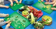 Children chopping vegetables
