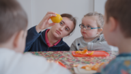 A young child and an adult looking at food