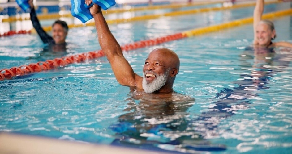 A older man enjoying swimming.