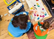 woman and young child doing arts and crafts