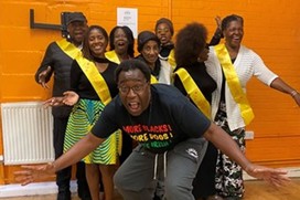 Group of people pose for camera