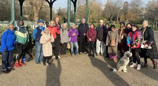 Walkers at Ruskin Park pose for photo outside of bandstand