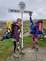 jackie walking at john ogeats sign