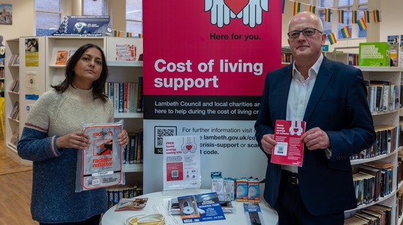 Cllrs Chowdhury and Amos at Brixton Library holding energy saving leaflet