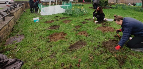Volunteers planting and seeding on Weir Estate