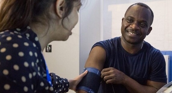 Male gets health check by doctor