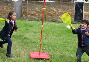 Children playing bat and ball