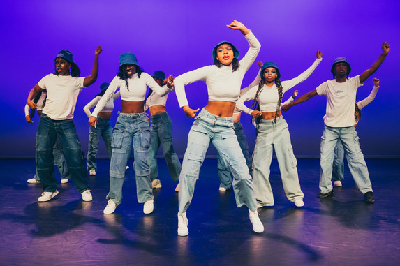 A group of girls posing in a dance workshop