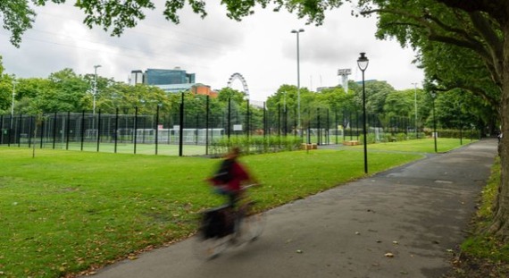 Person cycles through Lambeth park