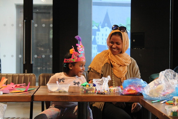 a child and parent in a workshop at Brixton House