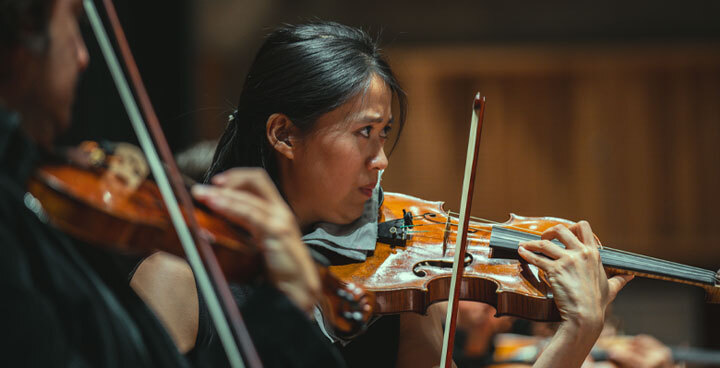Women playing a violin