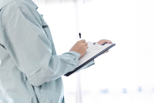 man with clipboard and pen