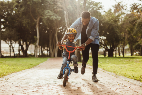 Father and son riding bike 