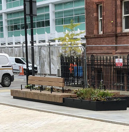 View of Huntley Street pocket park - with new seating, planting and paving in view
