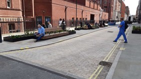 Huntley Street - people sat enjoying the planting and seating on the street