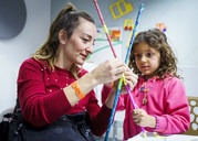 Woman playing with a child at the British Library event