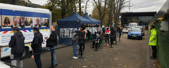 People queueing outside the vaccine bus