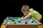 Young people playing pool
