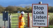 Stop, look, listen level crossing sign