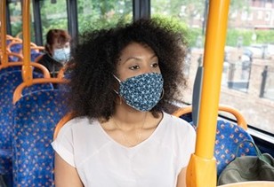Girl on bus with face mask