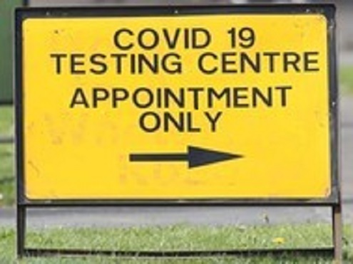 Covid testing sign with arrow