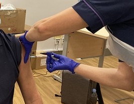 Lee Munn receiving vaccination