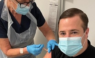 Max receiving COVID-19 jab