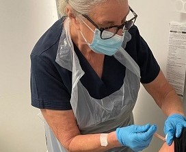 Max receiving COVID-19 jab