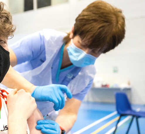 Young man getting jabbed