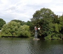 Harrow Lodge Park lake showing wind aerator 495px