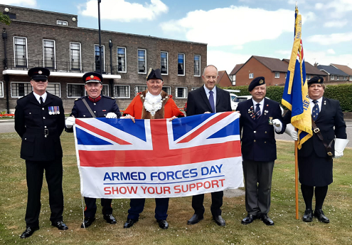 Picture of Armed Forces Day flag being raised outside the Town Hall 20 June 2022