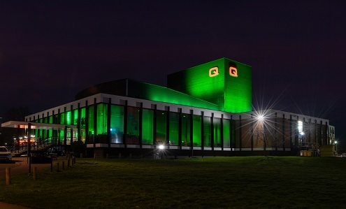 Queen's Theatre Hornchurch at night lit up in green