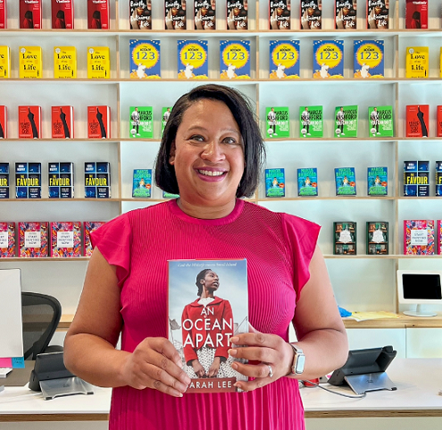 Author Sarah Lee holding book